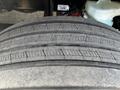 Close-up of a worn tire from a 2022 Freightliner M2 106 showing visible cracks in the tread pattern and a smooth surface