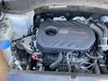 Engine of a 2018 Hyundai Santa Fe with a Turbo GDi cover visible detailing the layout and components of the engine bay