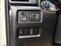 Detail view of the control panel in a 2018 Toyota 4Runner featuring buttons for mirror adjustment headlights and power outlets