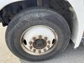Close-up of a tire mounted on a Hino 338 truck showcasing the wheel rim and lug nuts