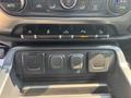 Dashboard controls of a 2017 Chevrolet Silverado 1500 with buttons for features like traction control and parking assist