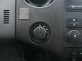 Control panel of a 2015 Ford F-450 with various knobs for adjusting settings including a four-wheel drive selector