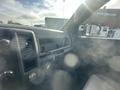 2012 RAM 2500 interior showcasing the dashboard with controls and an empty passenger seat