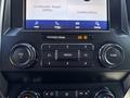 Dash of a 2020 Ford F-350 SD displaying audio controls and a touchscreen interface with options for phone connectivity and media settings