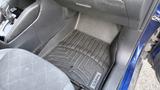 Interior of a 2019 Nissan Kicks showing a black rubber floor mat with the Nissan logo and textured pattern