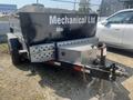A black 2022 Southland 10 Foot trailer with a toolbox in the front and a hitch attached at the rear