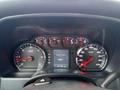 Dashboard of a 2015 GMC Sierra 1500 displaying various gauges including speedometer tachometer and digital readout for engine hours and odometer