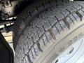 Close-up of the tire tread on a 2022 Ford F-550 showcasing the rugged design and depth of the grooves