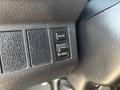 Close-up of a control panel from a 2012 Hino 338 featuring three buttons labeled MODE SELECT and SET RESET