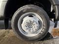 A close-up of the wheel and tire of a 2019 Ford F-550 showing a silver wheel rim with a central hub and black tire tread