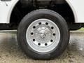 Close-up of a shiny chrome rim and tire from a 2024 RAM 5500 showcasing the wheel design and tread pattern
