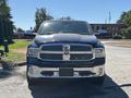 A 2015 RAM 1500 pickup truck with a chrome grille and front bumper facing forward