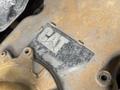 A close-up of a dirty metal plate with the CAT logo and the text TL1055C indicating it is part of a 2014 Caterpillar equipment