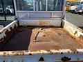A rusty 2015 Bobcat 5600 with an empty cargo bed showing dirt and debris on the metal surface