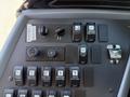 Dashboard controls of a 2009 International 3000 CE bus including various switches for heaters fans and lights