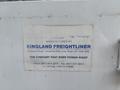 A label on a vehicle displaying information about Kingland Freightliner and contact details for the company