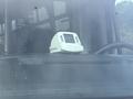 A white 2021 Ford Transit-350 dashboard with a mounted camera or monitor on the center console