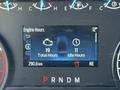 Dashboard display of a 2024 Ford F-550 showing engine hours total hours and idle hours with a mileage reading of 290.6 km