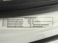 A label on a 2013 Ford F-450 SD detailing specifications like gross vehicle weight rating road ready weight maximum payload and maximum height of payload