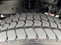 Close-up view of a tire tread from a 2017 Autocar Xpert featuring a deep and aggressive pattern designed for traction and durability