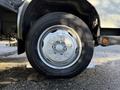 Close-up of a wheel from a 2014 Hino 195 with a silver rim and a Michelin tire showing the tread pattern