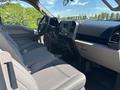 Interior view of a 2019 Ford F-150 showing the driver's seat dashboard and steering wheel with modern controls and upholstery