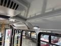 Interior view of a 2018 Chevrolet Express showing the ceiling with lights and a smooth surface