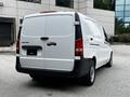 A 2020 Mercedes-Benz Metris van with a white exterior and black trim positioned at an angle showing the rear side and doors