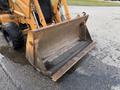 Front loader bucket of a 2005 Case 570 machine showing a large metal scoop designed for lifting and moving materials