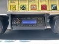 Dashboard of a 2012 Ford Econoline featuring a radio display and two speakers