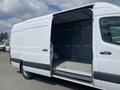 A 2025 Mercedes-Benz Sprinter van with an open side door revealing an empty and spacious cargo area