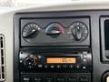 Dashboard controls of a 2014 International 7500 featuring climate control knobs and a radio display showing the time 106 PM