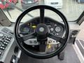 Steering wheel and dashboard of a 2012 Global M4 with gauges and controls visible