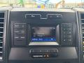 Dashboard of a 2020 Ford F-150 featuring a digital display with radio controls and climate settings