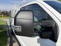A 2021 Ford F-150 with a black side mirror and chrome detail on the mirror housing