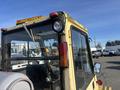 A 1993 Hyster H80XL forklift with a yellow exterior features a visible cabin, rear light, and front window displaying machinery controls inside