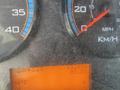 Dashboard of a 2014 International 7400 showing a speedometer with a needle near 20 mph an odometer reading 152050 miles and a temperature gauge indicating 84 degrees Fahrenheit
