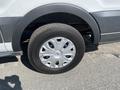 A close-up view of the wheel of a 2017 Ford Transit featuring a silver alloy rim and a black tire with tread visible on the surface