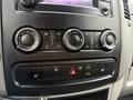 Control panel of a 2017 Mercedes-Benz Sprinter featuring climate controls and buttons for seat heating and hazard lights
