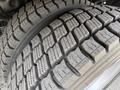 Close-up of a tire on a 2008 Ford F-550 showcasing deep tread patterns designed for traction and stability