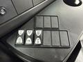 Dashboard control panel with buttons for dome lights and other functions in a 2013 Chevrolet Express
