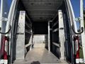 The interior of a 2024 Mercedes-Benz Sprinter 2500 showing metal shelving and a spacious cargo area