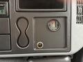 Control panel of a 2006 International 4200 showing switches and a fuel filter indicator with a keyhole near the bottom