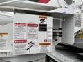 A 2020 International MV607 with safety warning labels and operational instructions prominently displayed on the side