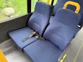 Two blue fabric seats with safety belts designed for a 2015 Chevrolet Express van