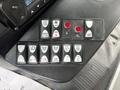 Control panel of a 2020 Chevrolet Express featuring buttons for mirror defrost, lift door, rear flasher, and various light settings