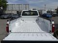 A white 2008 Ford F-250 SD truck bed with a clean, empty cargo area and no tailgate attached