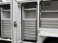 A 2024 RAM 5500 with open storage compartments featuring multiple metal sliding drawers inside