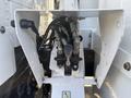 Close-up of the hydraulic control assembly on a 2019 Freightliner M2 106 featuring various hoses and a lever for operation