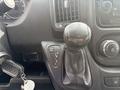 Dashboard of a 2017 RAM Promaster showing gear shift lever with positions for tow haul reverse neutral and drive along with radio controls and a key fob